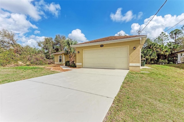 view of front of property featuring a garage and a front yard