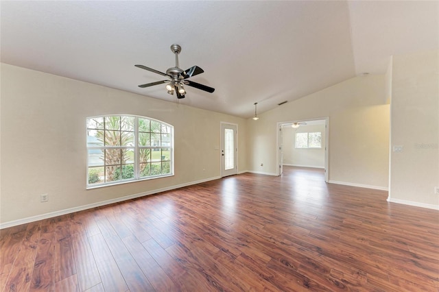 spare room with lofted ceiling, dark hardwood / wood-style floors, and ceiling fan