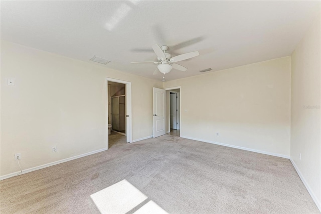 unfurnished bedroom featuring light carpet and ceiling fan