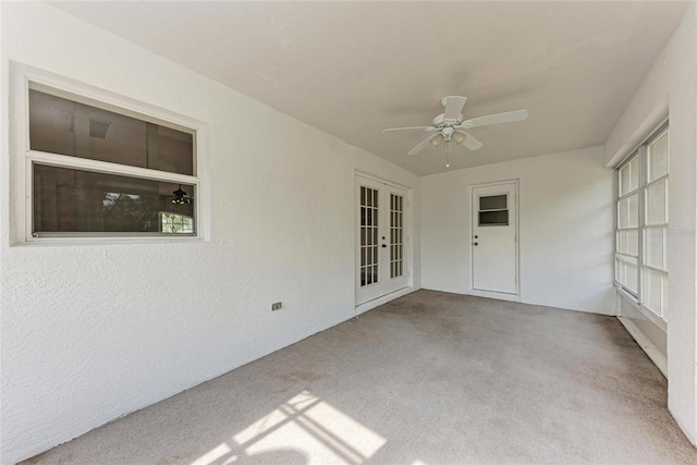 exterior space with french doors and ceiling fan