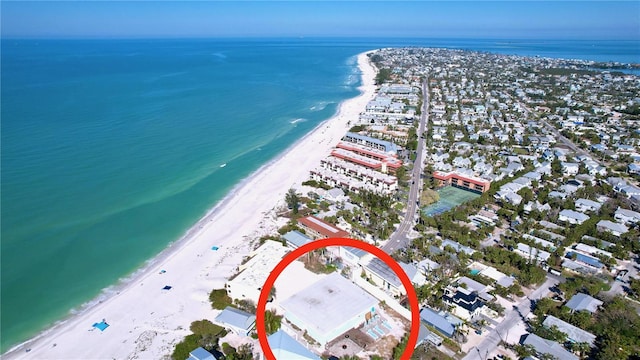 bird's eye view with a water view and a view of the beach