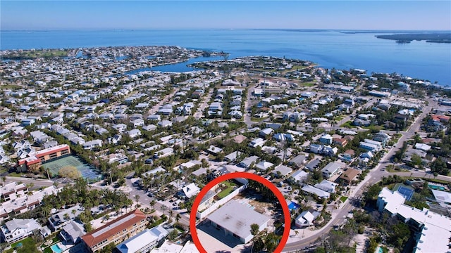 bird's eye view featuring a water view and a residential view