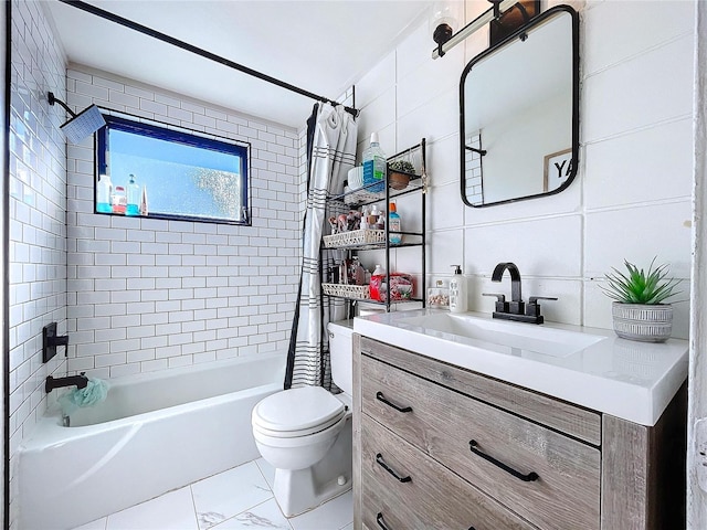 bathroom with marble finish floor, tile walls, shower / bathtub combination with curtain, toilet, and vanity