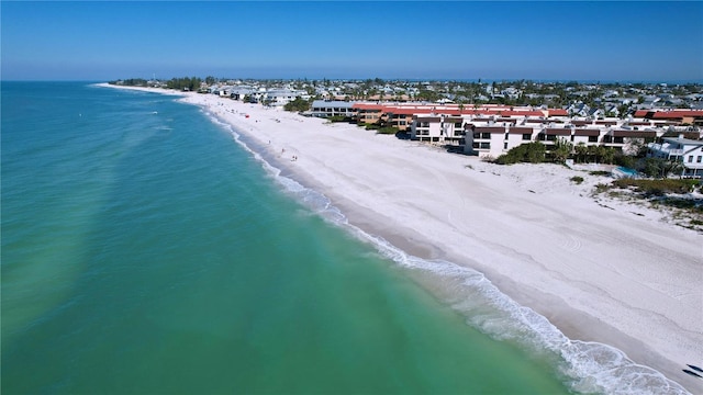 bird's eye view featuring a water view and a view of the beach