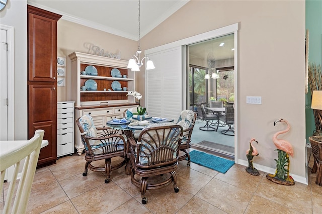 tiled dining room with a chandelier, crown molding, and lofted ceiling