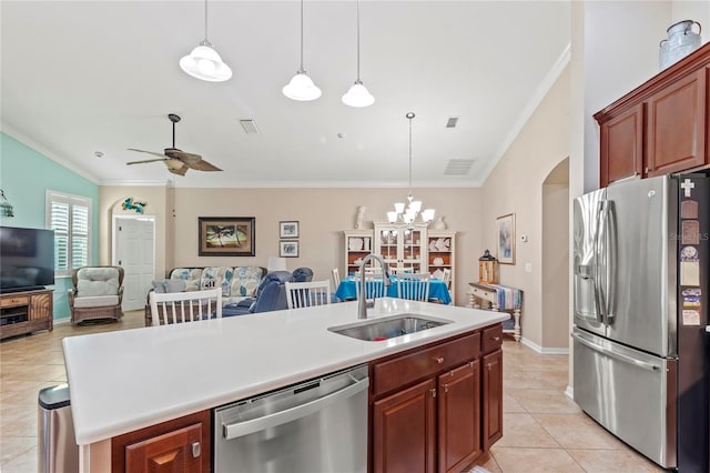 kitchen featuring sink, a center island with sink, stainless steel appliances, and pendant lighting