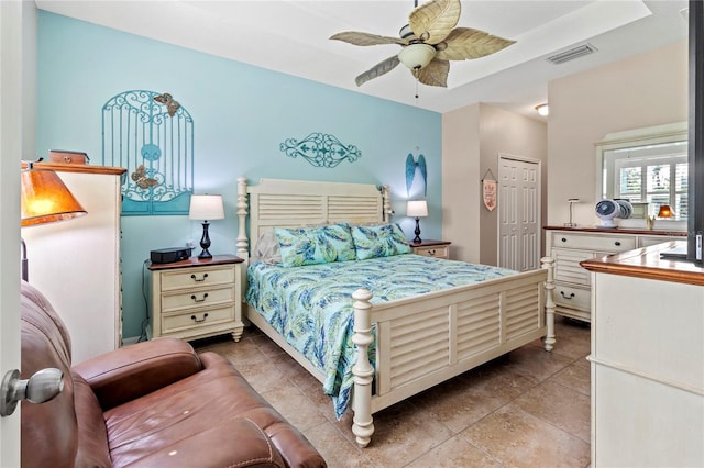 tiled bedroom with a closet and ceiling fan