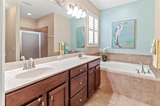 bathroom featuring separate shower and tub, vanity, and tile patterned flooring