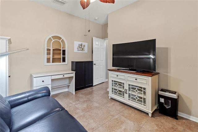 tiled living room featuring ceiling fan