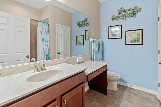 bathroom with curtained shower, vanity, toilet, and tile patterned floors