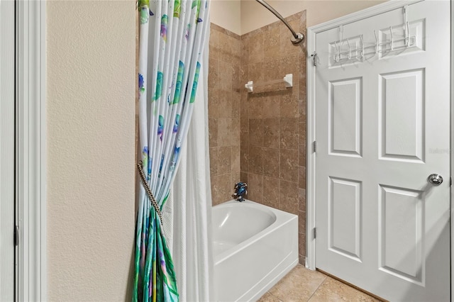 bathroom featuring tile patterned flooring and shower / tub combo