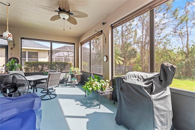 sunroom / solarium with ceiling fan