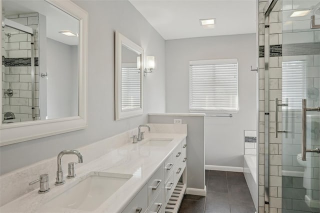 bathroom featuring tile patterned flooring, vanity, plenty of natural light, and plus walk in shower