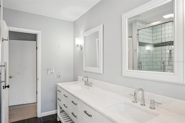 bathroom with vanity, tile patterned flooring, and a shower with door