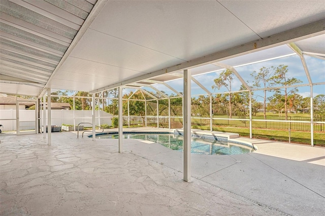 view of swimming pool featuring a lanai, a jacuzzi, and a patio area