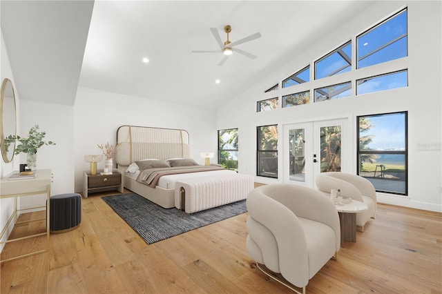4620 Riverview Blvd, Bradenton, FL 34209 - bedroom featuring high vaulted ceiling, recessed lighting, access to outside, french doors, and light wood-type flooring