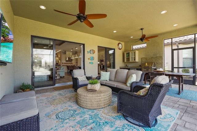 view of patio / terrace featuring an outdoor hangout area, area for grilling, a grill, and a ceiling fan