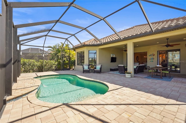 outdoor pool featuring a ceiling fan, glass enclosure, outdoor lounge area, and a patio