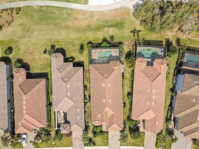 birds eye view of property with a residential view