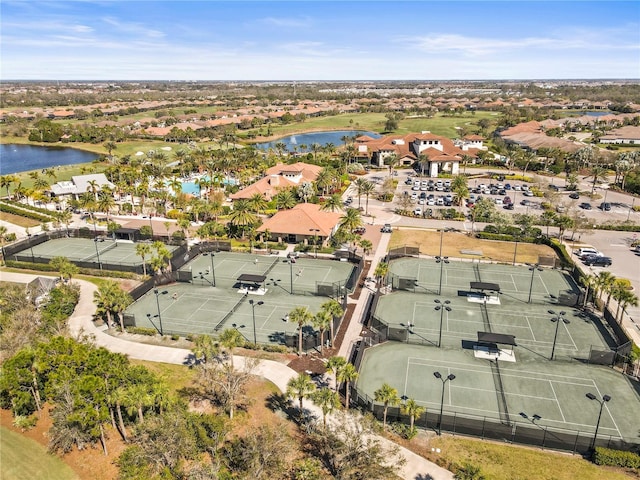 drone / aerial view with a water view and a residential view