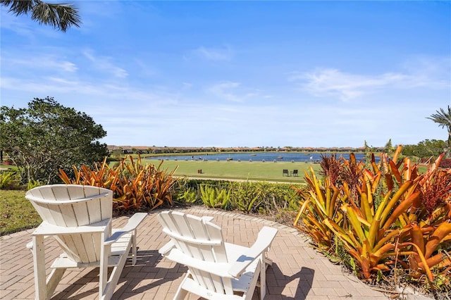 view of patio featuring a water view