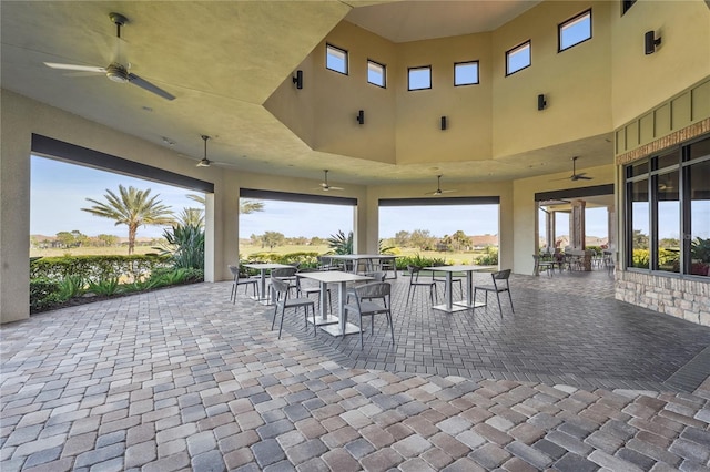 view of patio featuring outdoor dining space and ceiling fan