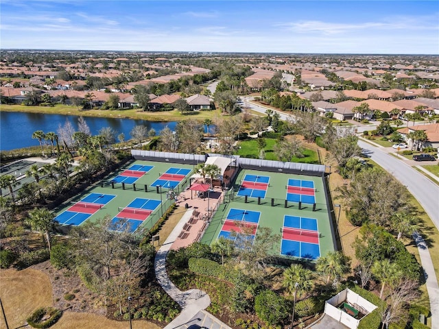 bird's eye view featuring a residential view and a water view