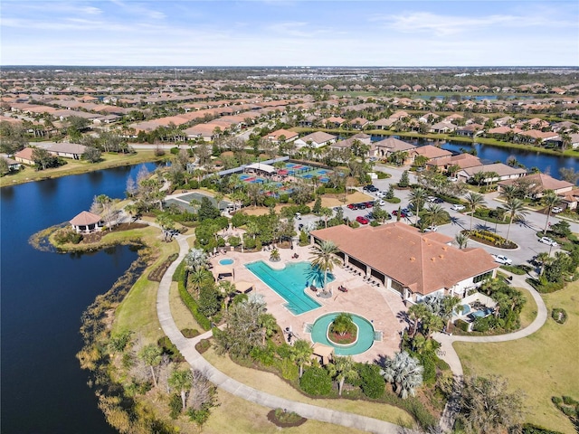 bird's eye view with a residential view and a water view