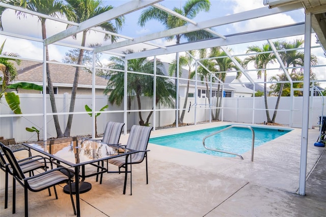 view of pool with a fenced in pool, a lanai, a patio area, and a fenced backyard