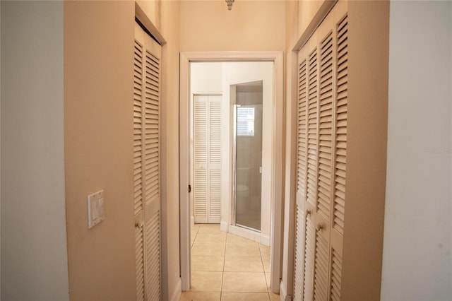 hallway featuring light tile patterned flooring