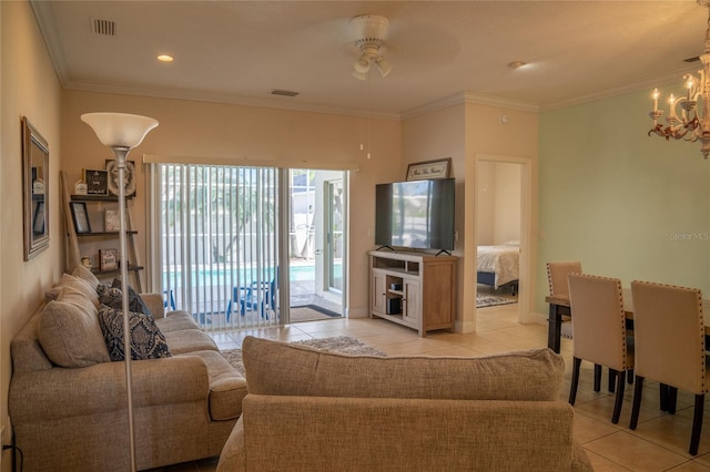 living area with ornamental molding, visible vents, and light tile patterned floors