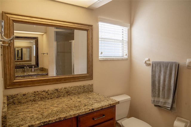 full bath featuring toilet and vanity