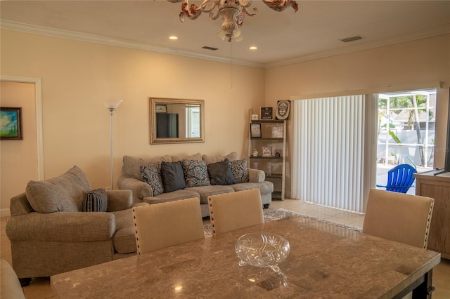 living area with light tile patterned floors, ornamental molding, visible vents, and recessed lighting