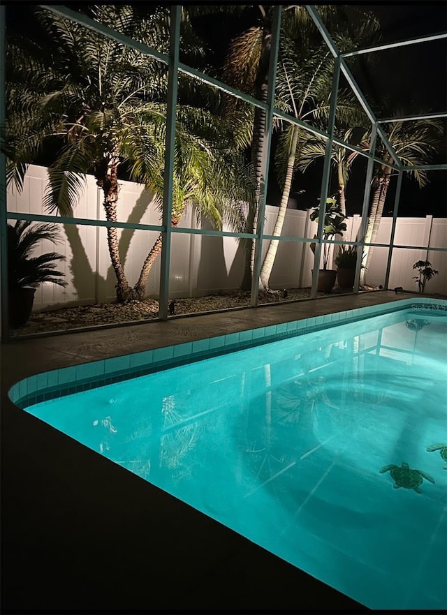 view of pool featuring a fenced in pool, a lanai, and a fenced backyard