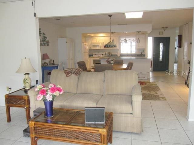 living area with light tile patterned flooring