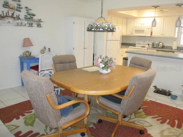 dining area featuring light tile patterned floors