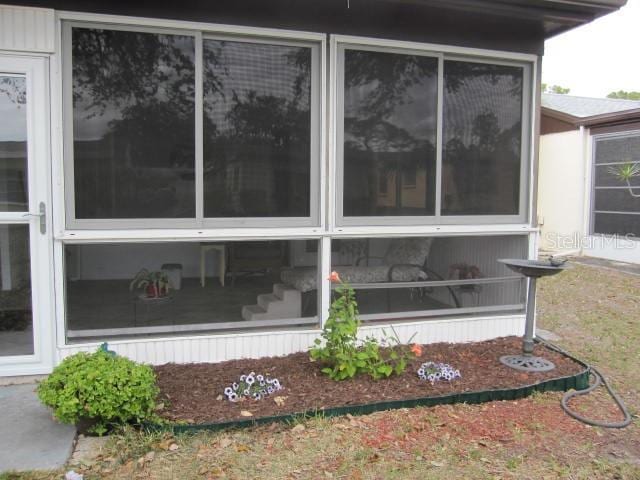 view of home's exterior featuring a sunroom