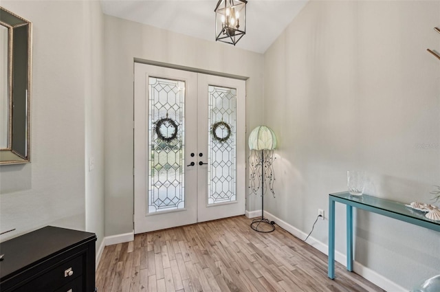 7415 36th Ave E, Palmetto, FL 34221 - foyer entrance featuring light hardwood / wood-style flooring and french doors