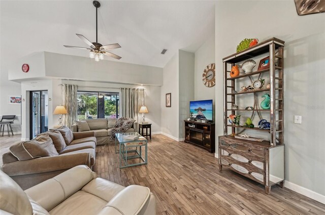 7415 36th Ave E, Palmetto, FL 34221 - living room featuring ceiling fan, high vaulted ceiling, and hardwood / wood-style floors