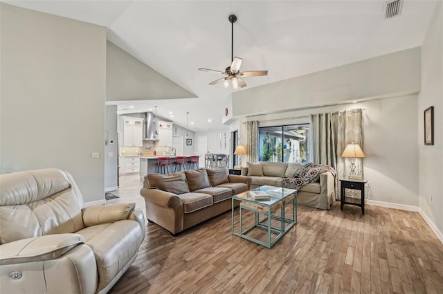 7415 36th Ave E, Palmetto, FL 34221 - living room with wood-type flooring, high vaulted ceiling, and ceiling fan
