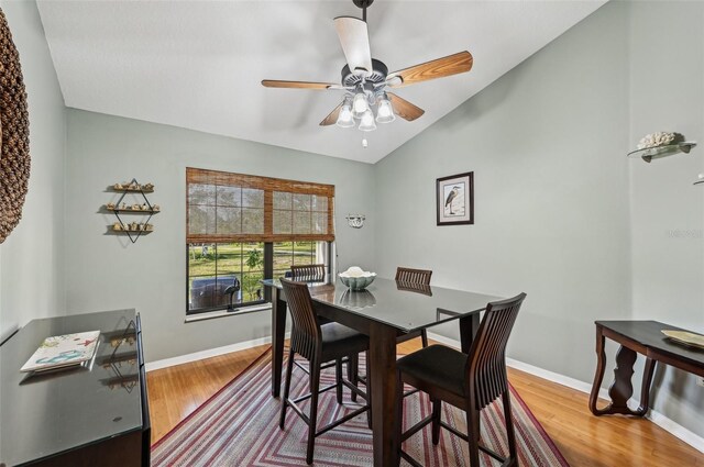 7415 36th Ave E, Palmetto, FL 34221 - dining space with hardwood / wood-style flooring, vaulted ceiling, and ceiling fan