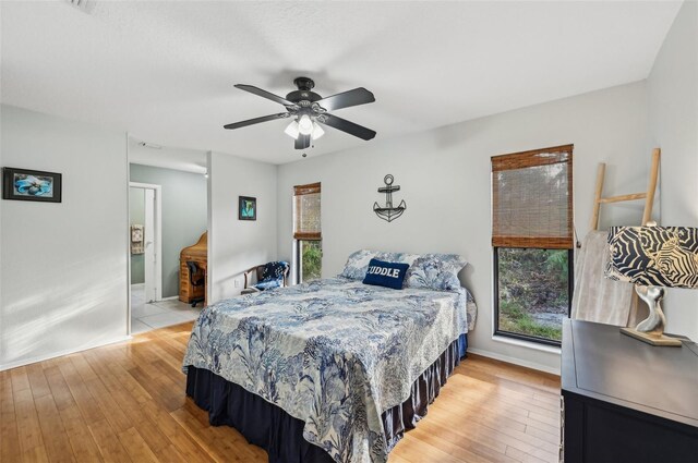 7415 36th Ave E, Palmetto, FL 34221 - bedroom with ceiling fan and light wood-type flooring