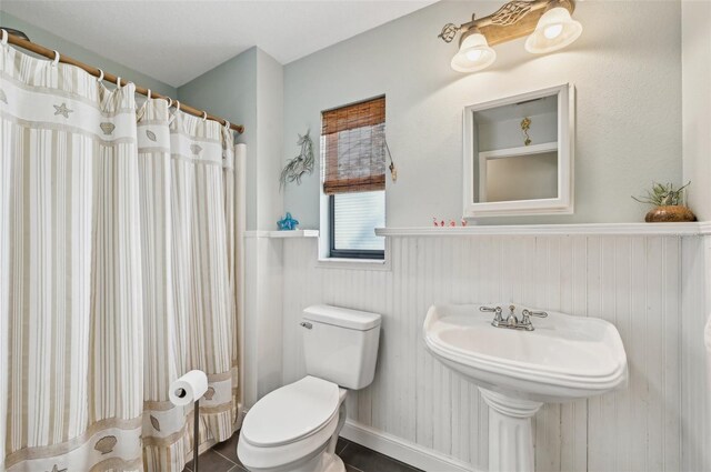 7415 36th Ave E, Palmetto, FL 34221 - bathroom with walk in shower, tile patterned floors, and toilet