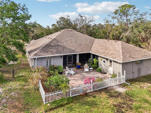 7415 36th Ave E, Palmetto, FL 34221 - rear view of house featuring a patio and a lawn