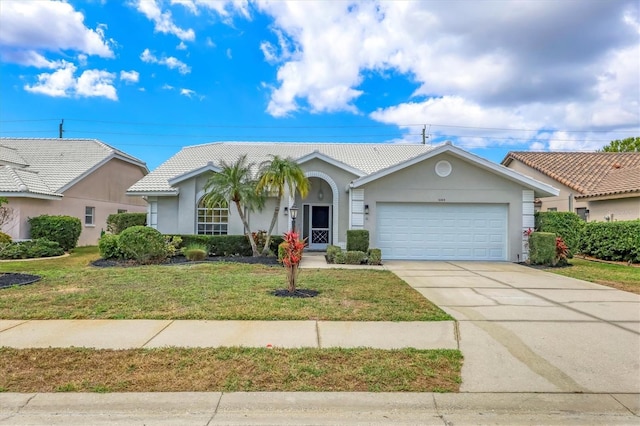 ranch-style home featuring a garage and a front yard