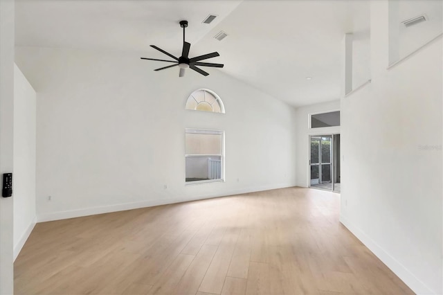 empty room featuring ceiling fan, high vaulted ceiling, and light hardwood / wood-style floors