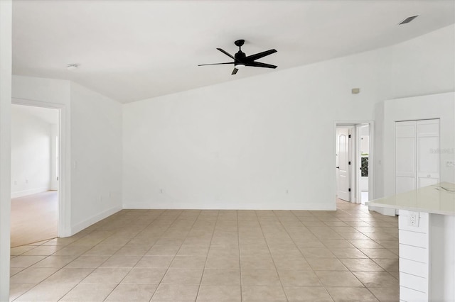 unfurnished room featuring light tile patterned flooring and ceiling fan