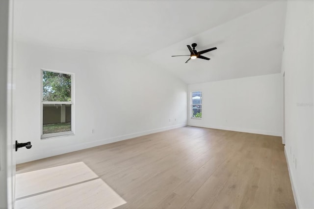 unfurnished room with ceiling fan, lofted ceiling, and light hardwood / wood-style floors