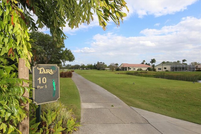 view of property's community with a lawn