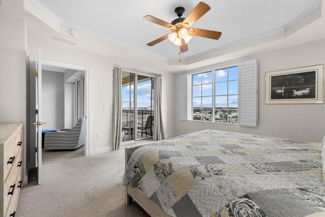 bedroom with light carpet, access to outside, a raised ceiling, and crown molding